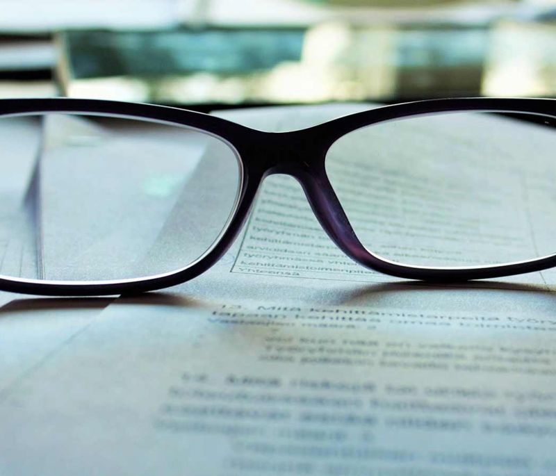 glasses sitting on papers